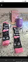 Photo showing the wine tumbler, novelty socks, and the box packaging on a countertop.