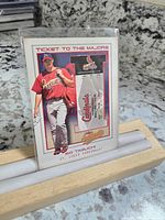 Full view of So Taguchi baseball card with embedded Rockies vs Cardinals game ticket stub insert.