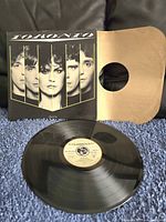 Full view of the Toronto vinyl record album cover, inner sleeve, and the black vinyl record itself.