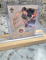 Front photo of Jason Spezza hockey card showing player image, card number 546/750, and area containing two-color jersey swatch.