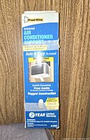 Photo of front side of Frost King Universal Air Conditioner Support box showing product name, usage, and warranty info.