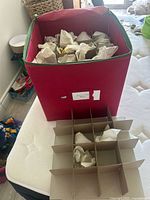 red storage cube and cardboard divider