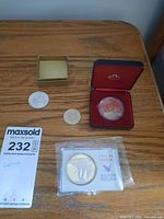 Full lot with four coins, cases visible