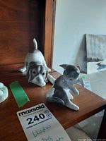 Dog and cat figurines on shelf