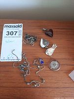 All seven jewelry pieces laid out for overview