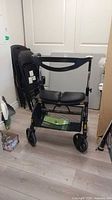 Front view of Evolution Espresso rollator walker showing seat, basket and wheels