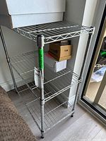 Front angled view showing entire four-shelf chrome wire unit