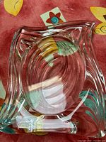 Top view of Mikasa Emotion crystal picture frame showing oval wavy concentric pattern with clear polished crystal.