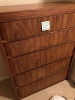 Front view of the 5-drawer wooden dresser with a note indicating lot 126 and the dimensions.