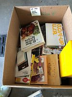 Box with assorted cookbooks including 'All-Time Favorite Recipes' and 'Close-Up U.S.A.' visible on top