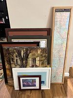 Front view of stacked framed artworks with Appalachian Trail map on right