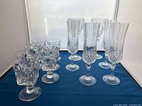 All 13 pieces grouped on blue cloth showing sizes and patterns