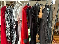 Overview of garments hanging on rolling rack
