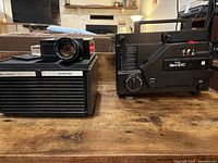 Bell & Howell Slide Cube projector beside Sears Silent 200 projector