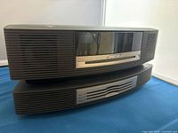 Front view of Bose Wave Music System stacked on Multi-CD Changer