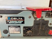 Front view showing Delta branding, speed chart and control dial