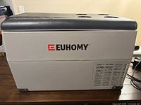 Left side view showing EUHOMY branding, lid with cup holders, vent grille