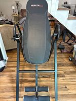 Full view of Health Gear inversion table showing padded backrest, frame and ankle supports