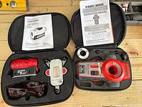 Both laser level kits open in cases showing contents