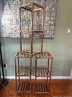 Full view of assembled modular plant stand showing all nine shelves