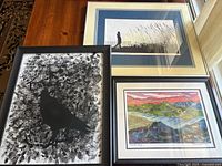 All three framed art prints side by side on tabletop