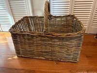 Side view of rectangular wicker basket showing woven sides and handle