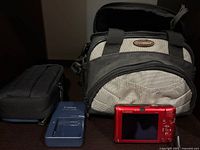 Canon compact camera, Canon charger, Quantaray bag, accessory pouch