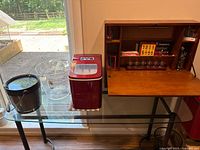 Overall lot view showing bar cabinet, ice maker, ice buckets