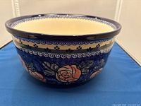 Side view showing exterior rose motif and cobalt spiral border