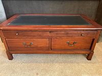 Front view showing drawers and glass top