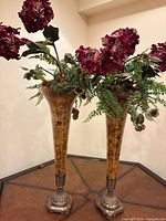 Full view of both trumpet floor vases with arrangements