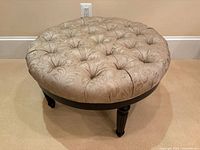 Top view showing full round beige tufted surface