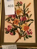 Full view of framed floral embroidery