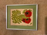 Full view of framed embroidered tomato art