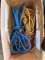 Top view of box showing blue and yellow extension cords