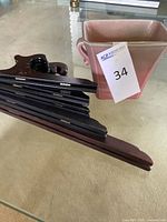 Vase and stacked wooden plate holders on table