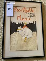 Front view of framed Place Pigalle menu showing full artwork and frame