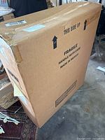 Exterior of original cardboard box marked Fragile Made in Mexico