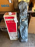 Boxed Knight Connexion pull cart, blue golf bag