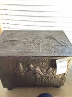 Front view showing embossed figures and measurement tag