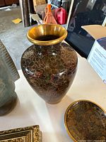 Large cloisonné vase with floral pattern and brass rim