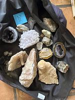 Group view of all mineral and fossil pieces inside bag