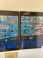 Both framed posters side by side showing full artwork and text