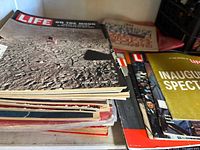Stack of Life issues topped by Aug 8 1969 moon landing cover