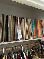 Shelf with multiple vinyl records including The Swing Era box sets and assorted classical albums