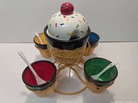 complete set assembled showing bowls, spoons, stand and lid