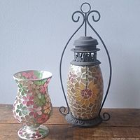 Lantern and vase side by side showing mosaic patterns and overall design