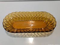 Top view of amber pressed glass serving dish