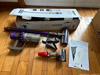 Overall layout of vacuum body, wand, tools, charger and box