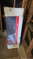 Box with image and label showing Swisher 40 inch plugger aerator product and branding.